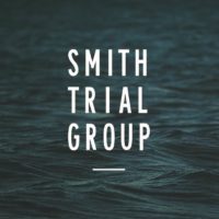 Smith Trial Group Logo with dark Water in the Background