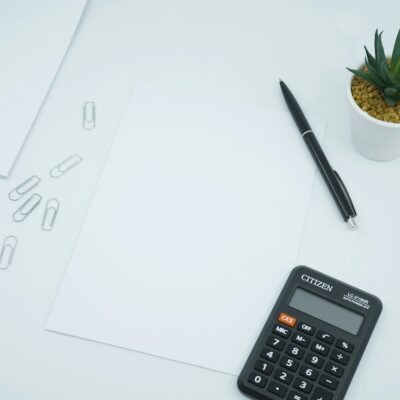 Calculator and pen on paperwork Calculator and pen on paperwork