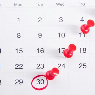 Calendar with red push pins Calendar with red push pins