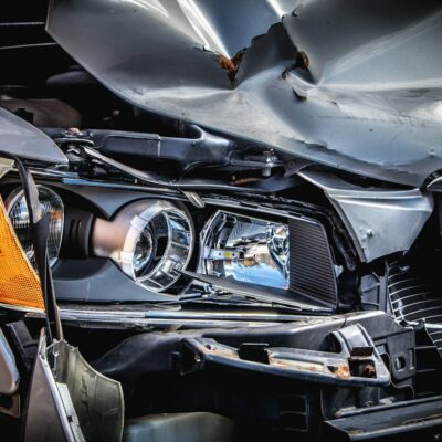 Damaged car with a crushed hood after a crash