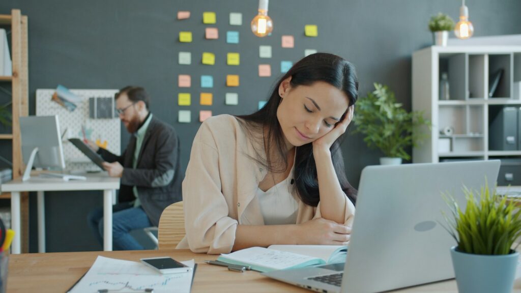 Employee at her desk dealing with sexual harassment at work