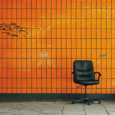 Empty office chair against a wall