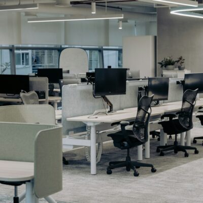 Empty office with rows of desks after a layoff Empty office with rows of desks after a layoff