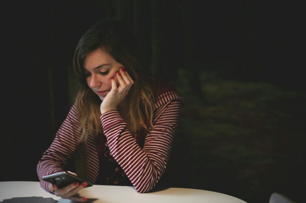 Woman on a phone call with an insurance adjuster after an accident