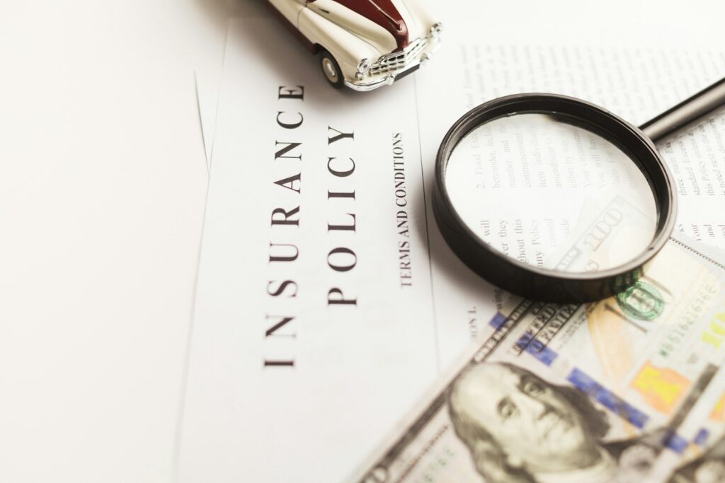 Insurance policy under a magnifying glass - California insurance fraud whistleblower lawyer