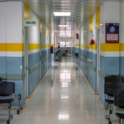 Clinic hallway with waiting-room chairs
