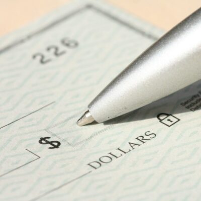 Pen over a paycheck Pen over a paycheck