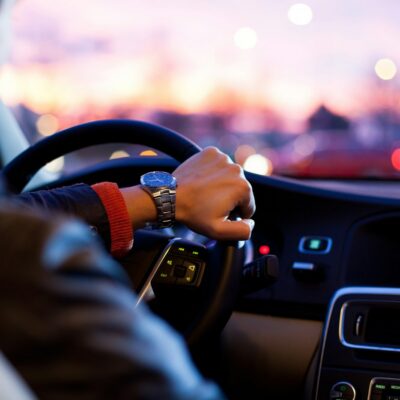 Rideshare driver behind the wheel of a car Rideshare driver behind the wheel of a car