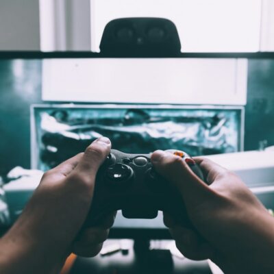 Roblox child exploitation lawsuits Game controller in front of a television - Roblox child exploitation lawsuits