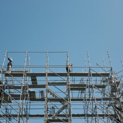 Workers on scaffolding at a construction site Workers on scaffolding at a construction site