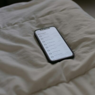 Cell phone on a bed - social media addiction lawsuits in California