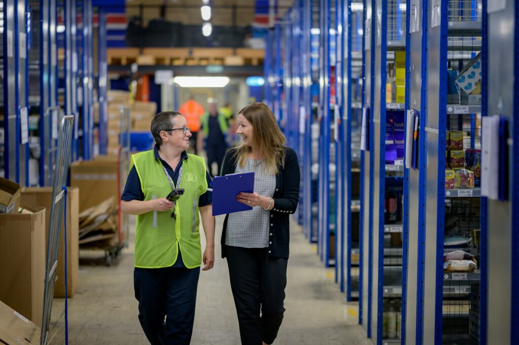 Warehouse workers in an aisle, a common setting for California wage and hour claims
